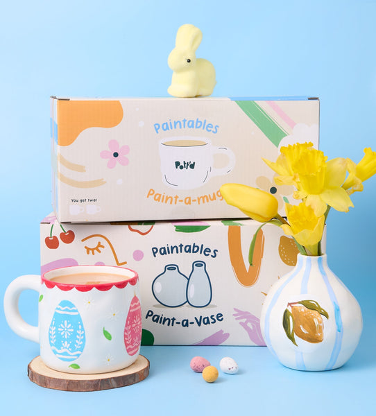 Paintables Perfect Pair Mugs set with paintable heart-themed mugs, paint pots, brushes, and display box on white background.